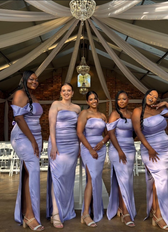 Bridesmaids in lavender satin gowns, reception